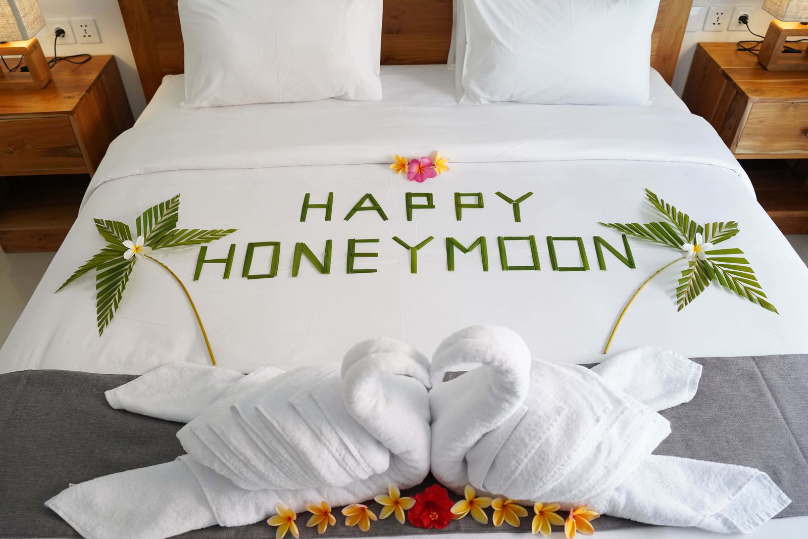 Spacious regular room at Royal Crown Villas with teak furnishings and tropical garden view